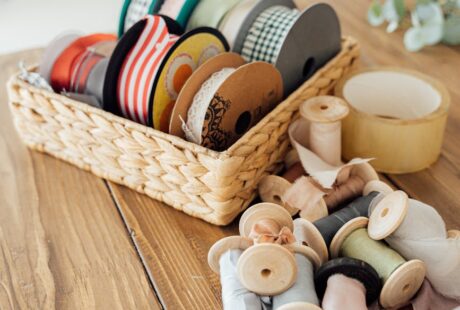 brown wooden woven basket with assorted color ceramic jars