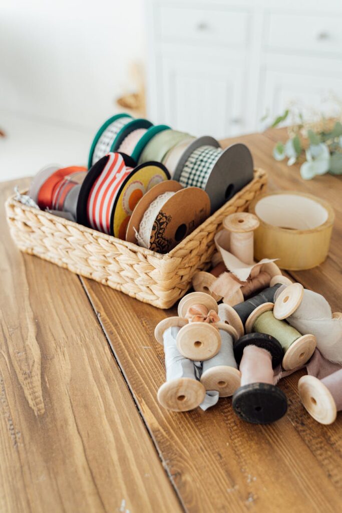 brown wooden woven basket with assorted color ceramic jars