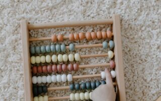 close up shot of a child playing abacus