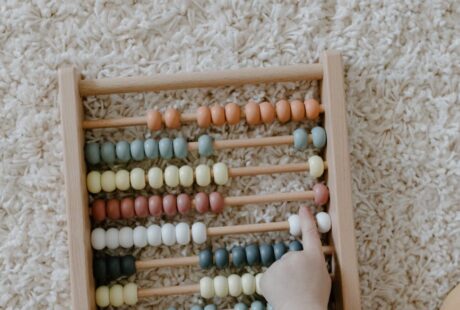 close up shot of a child playing abacus