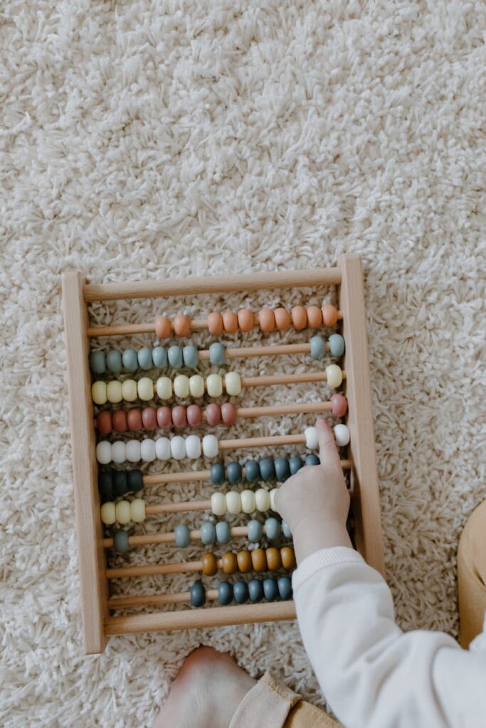close up shot of a child playing abacus