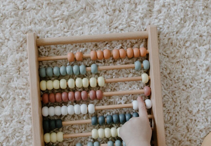close up shot of a child playing abacus